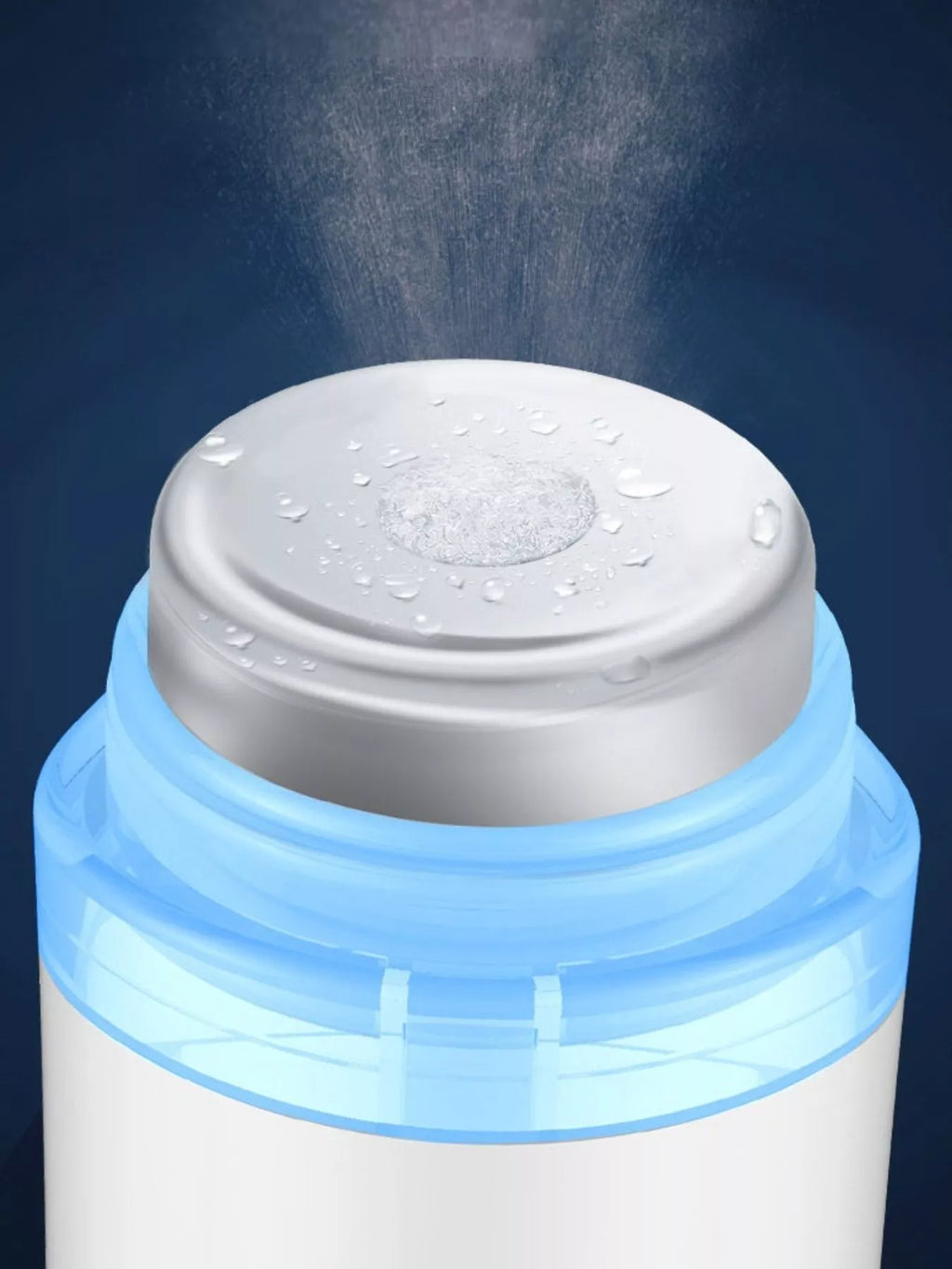 White beauty device with chrome cap, top droplets, and blue outer ring