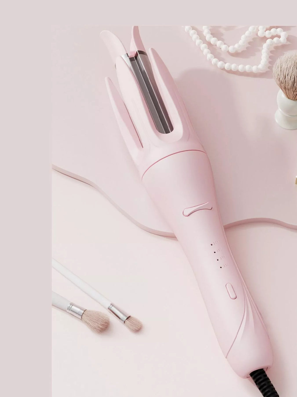 Blush Pink automatic rotating ceramic curling iron, back/side view with vents and dial