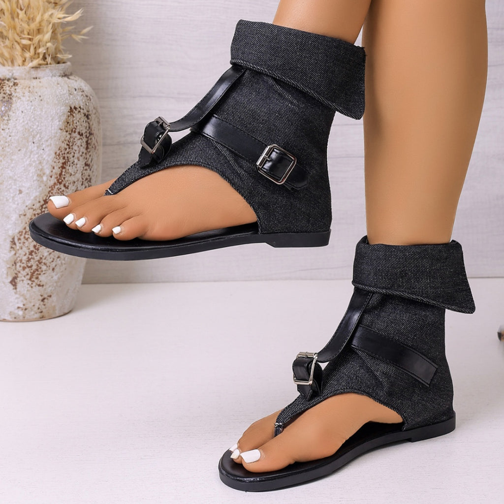 Black toe-post sandals with two buckle straps and open toe, flat sole