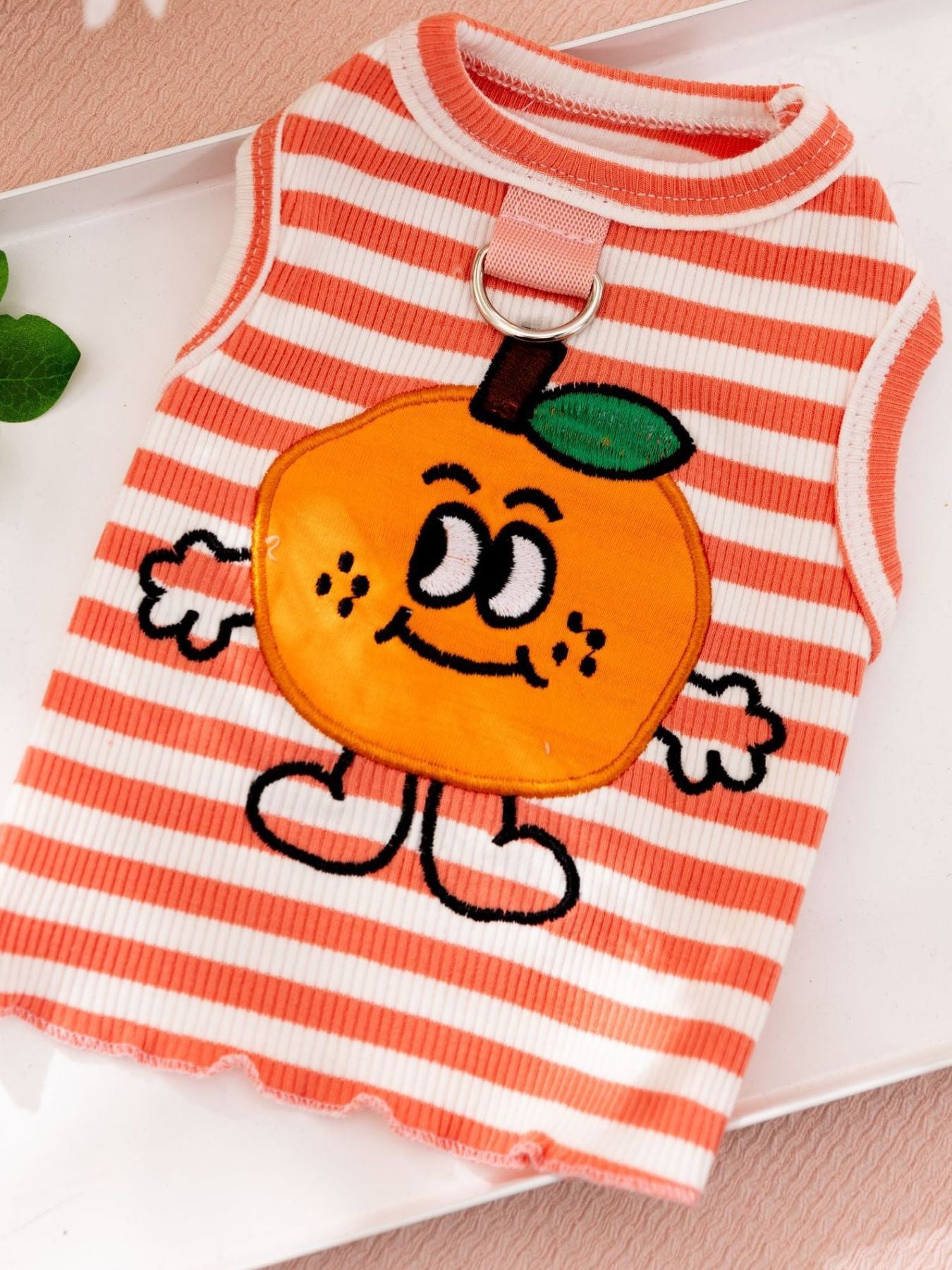 Orange striped pet tank with lion-like bear face patch and front collar ring