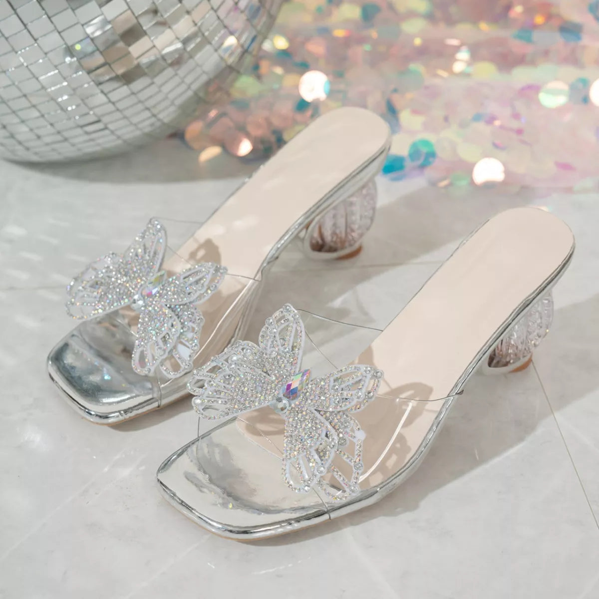 Gray open-toe slip-on sandals with rhinestone butterfly embellishment and thin heel