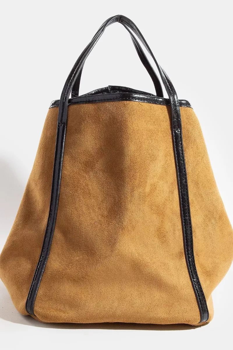 Tan suede tote with black faux-leather trim, structured square base, top handles.