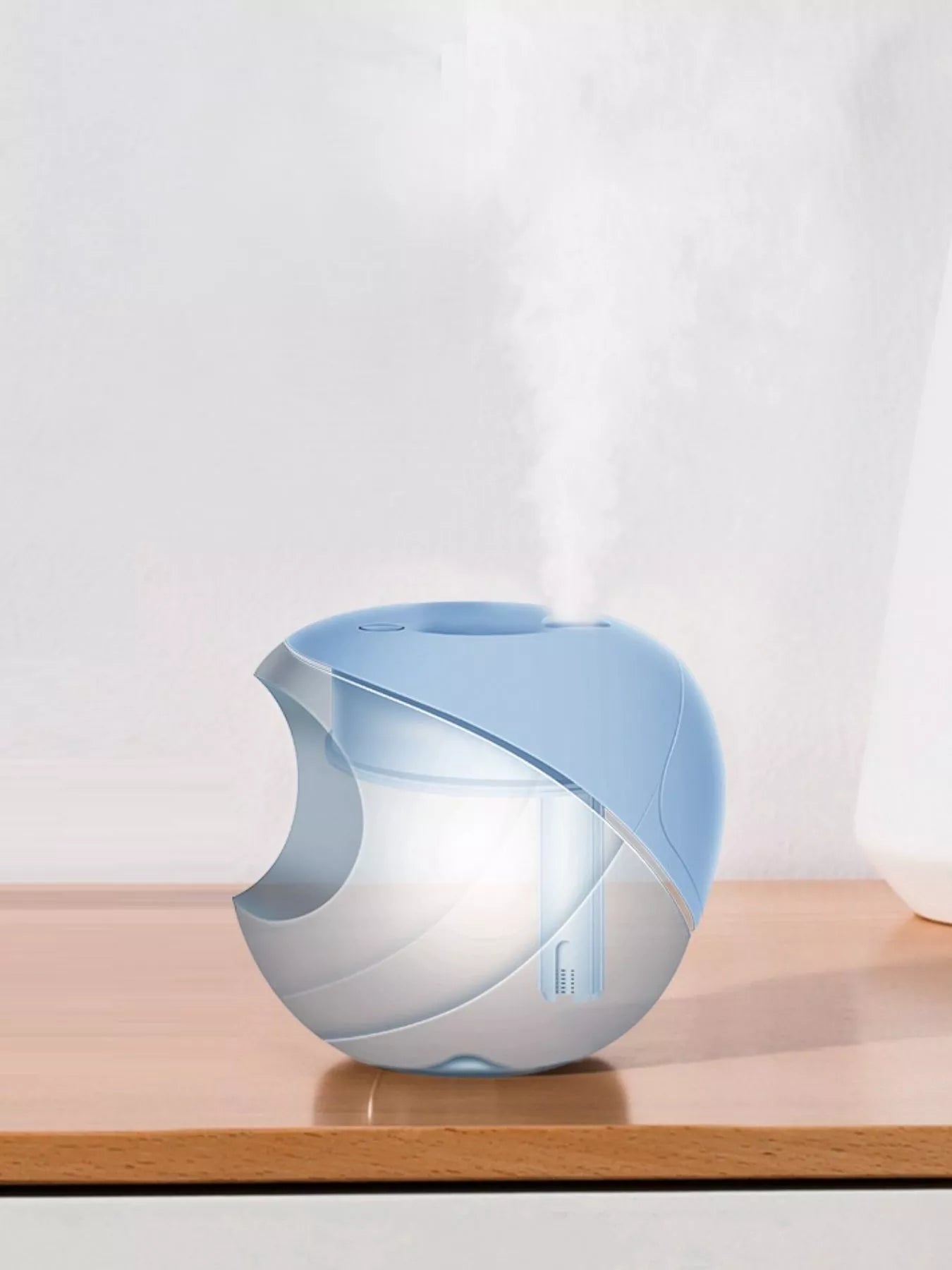 Light blue apple-shaped humidifier with visible mist column